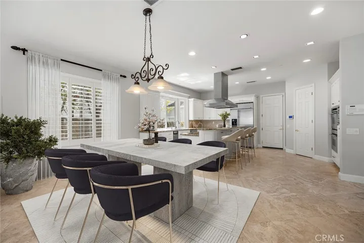 VIRTUALLY STAGED EATING AREA OPEN TO THE KITCHEN AND GREAT ROOM