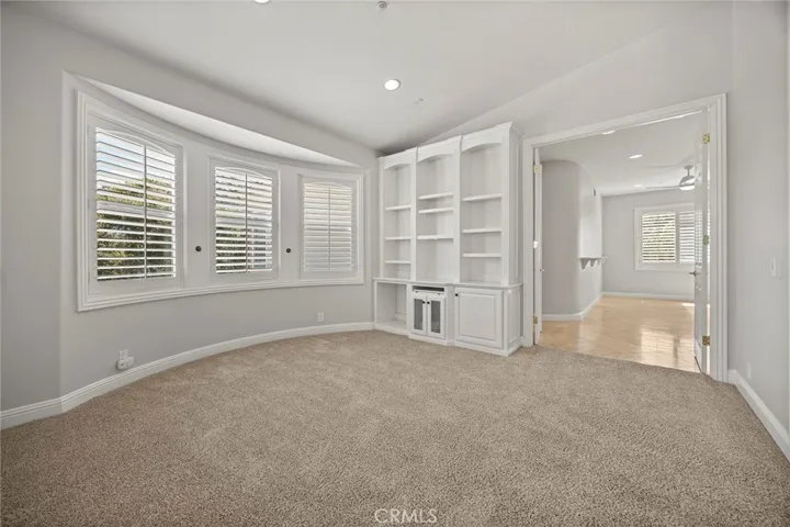 PRIMARY BEDROOM RETREAT AREA LEADING TO THE BATHROOM WITH LARGE EXERCISE SPACE