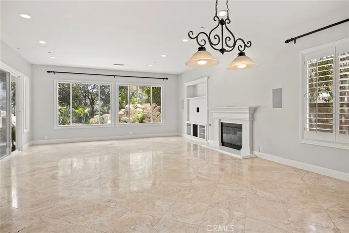 HUGE FAMILY/GREAT ROOM WITH FIREPLACE AND SLIDING DOOR ACCESS TO THE PATIO AND POOL