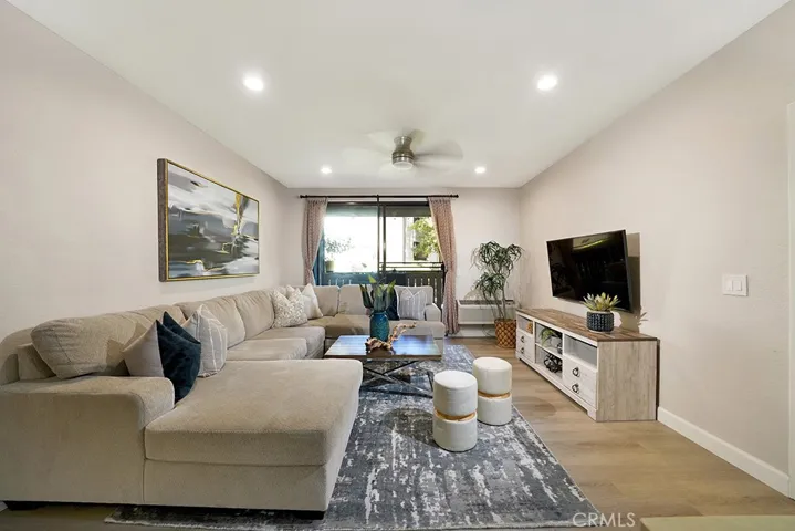View from living room through sliding doors to enclosed patio.
