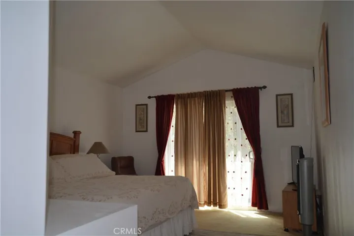 PRIMARY BEDROOM WITH BALCONY