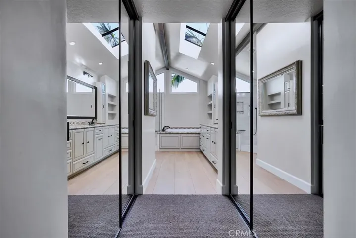 Primary Mirrored Doors for both Walk-in Closets