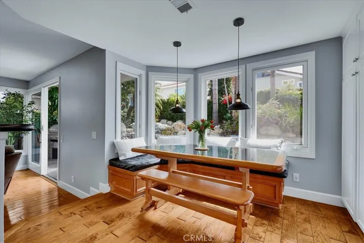Kitchen Nook w/built-in custom black granite table & storage bench to be included in sale.