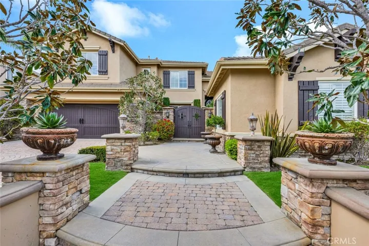 Beautifully designed exterior with inviting landscape and lighting.