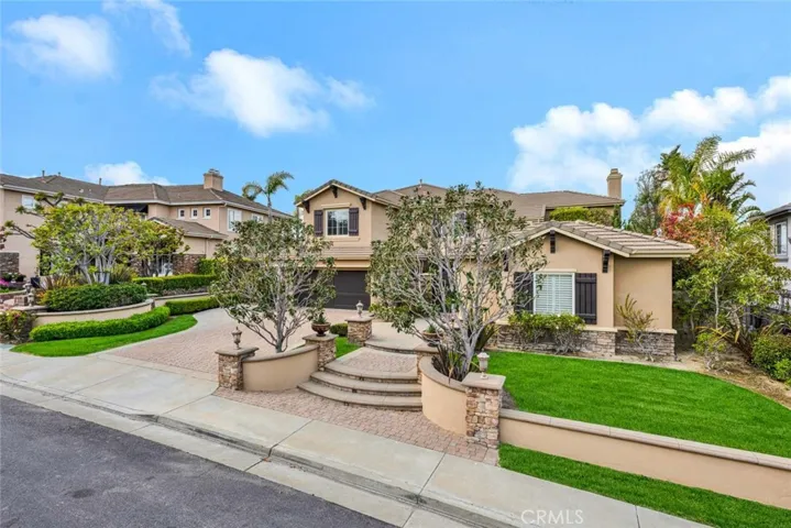 Exquisite home situated on the only single loaded street in guard-gated Summit Pointe.