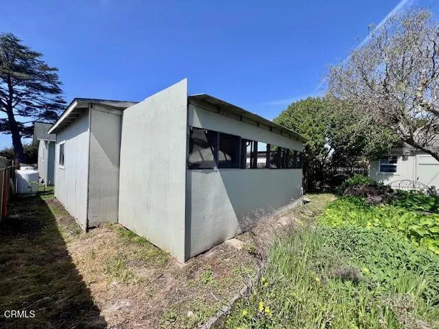 East side of Chicken Coop behind Studio