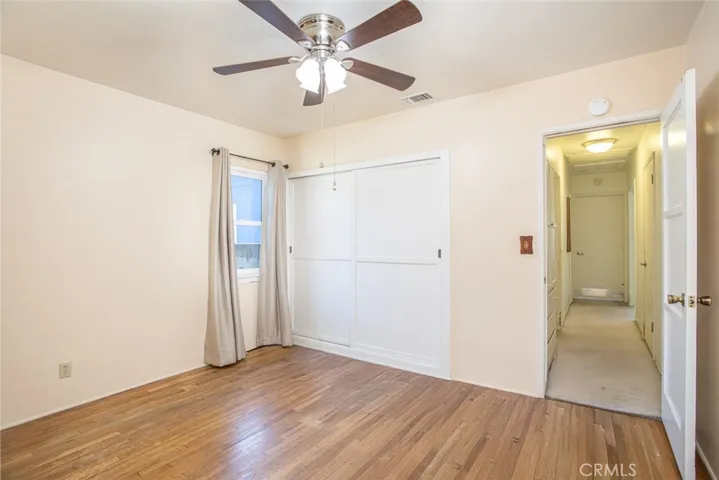 Bedroom at end of hallway with direct access to full bath