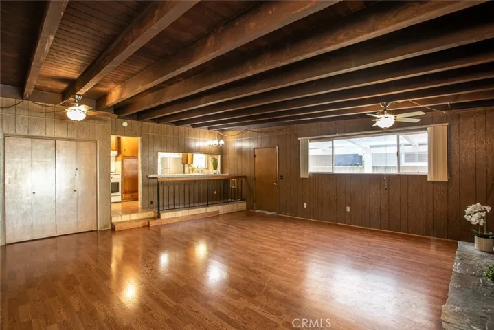 Extra Spacious Family Room with floor to ceiling stone fireplace