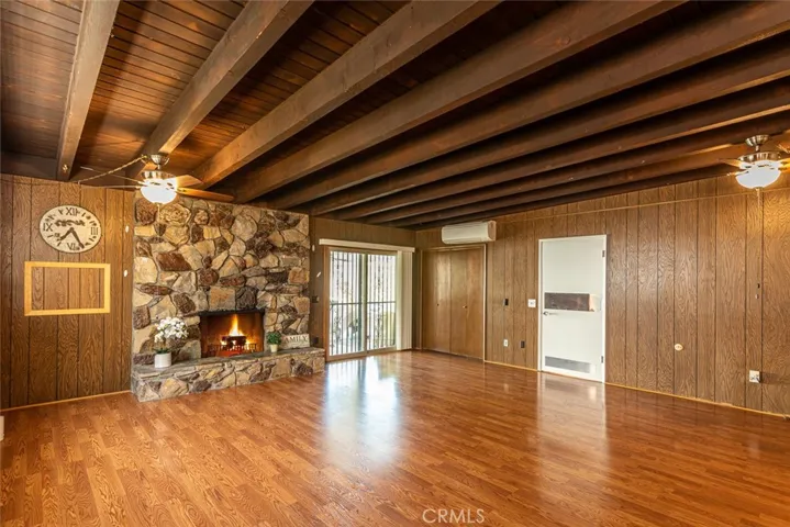 Extra Spacious Family Room with floor to ceiling stone fireplace