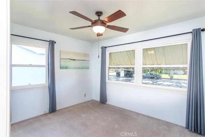 Bedroom at front of home with original classic metal awnings