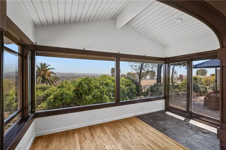 Wonderful sunroom/office/den with views from all 3 walls of glass