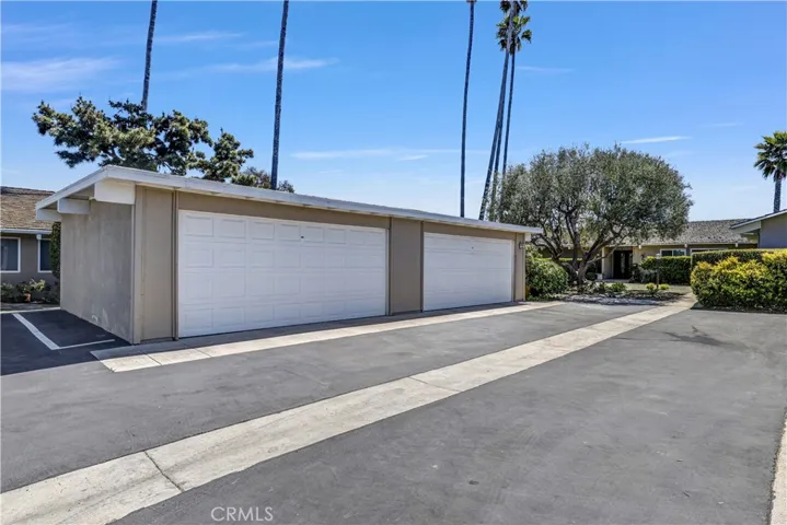 Very large detached 2 car garage is immediately adjacent the home and has an entrance door behind the garage for easier access to the front of the home