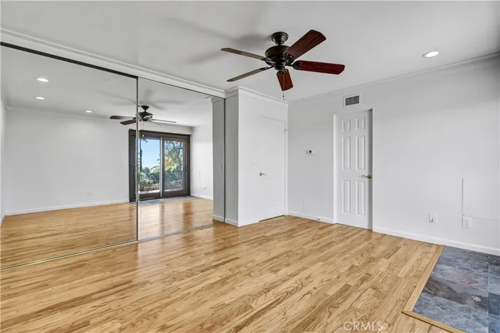 Primary bedroom with sweeping views open to the patio