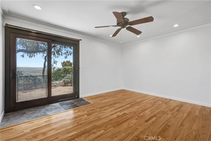 Primary bedroom with sweeping views open to the patio