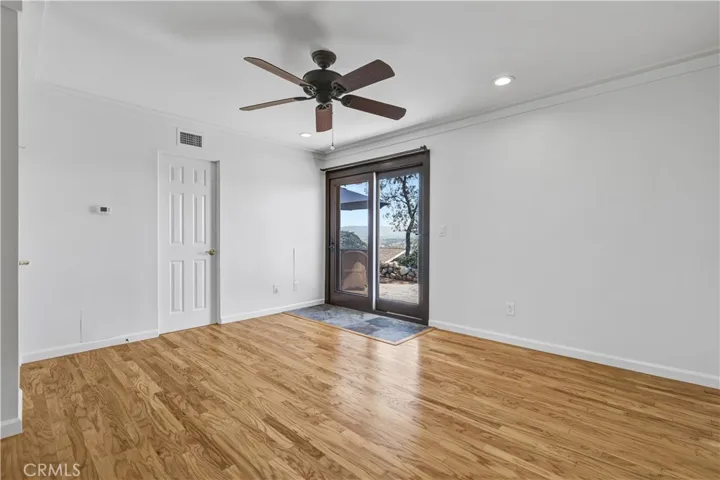 Primary bedroom with sweeping views open to the patio