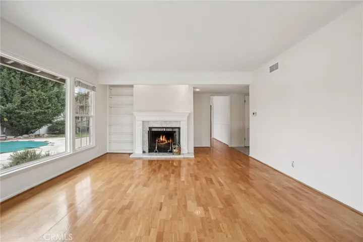 Living room looking to entrance, kitchen and secondary bedrooms