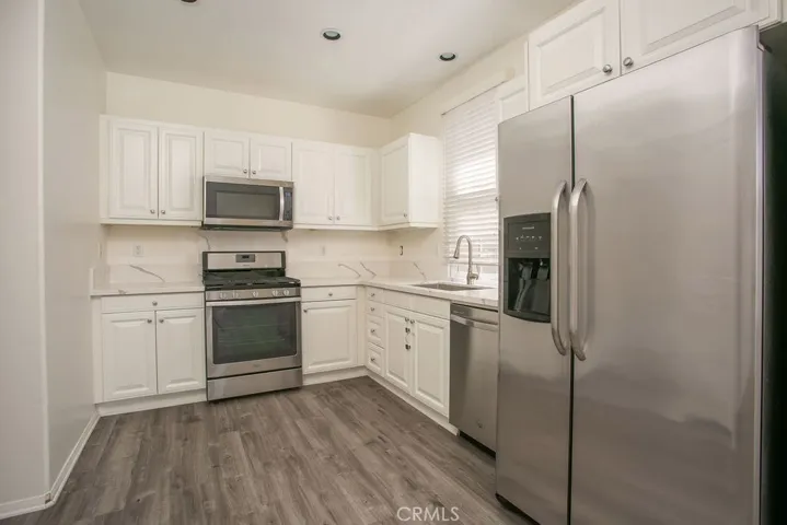 Stainless steel appliances and new quartz countertops are updated features to this home.