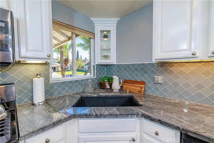 Large Kitchen sink and window looking out to the front yard