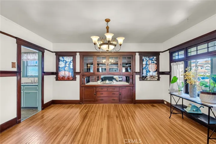 Formal dining room with original built-in hutch and picture rail.