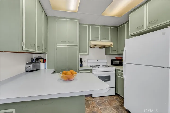 For a cozy kitchen, look at all of the cabinetry and counter space!