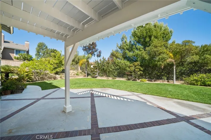 Designed for relaxation and entertaining, the tranquil backyard features a custom covered patio surrounded with mature trees.  This private space is perfect for outdoor gatherings, morning coffee, or relaxing in the evening.