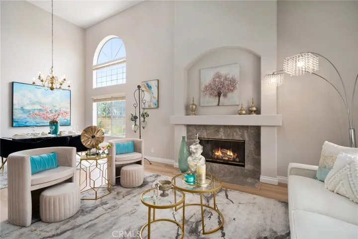 The formal entry welcomes you into the grand living room with soaring ceilings and a cozy fireplace (one of three in the home).  The formal dining room provides ample space for entertaining.