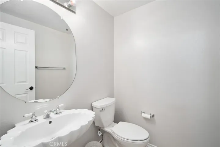 In addition to the full bath on the main level, there is also a half guest bath.