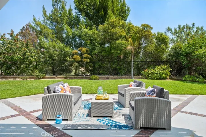 Designed for relaxation and entertaining, the tranquil backyard features a custom covered patio surrounded with mature trees.  This private space is perfect for outdoor gatherings, morning coffee, or relaxing in the evening.
