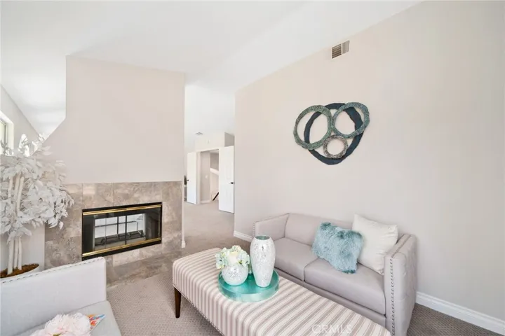 The expansive primary suite includes a private lounge area—a true retreat—featuring high ceilings.