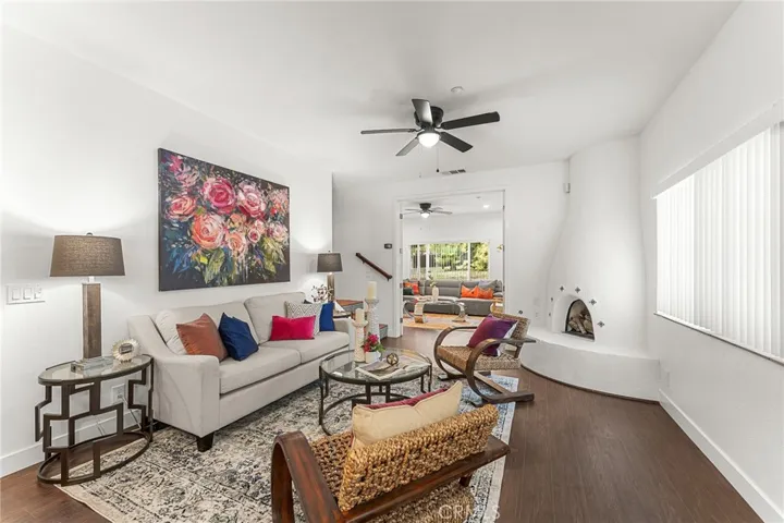 living room with fireplace open to kitchen and family room