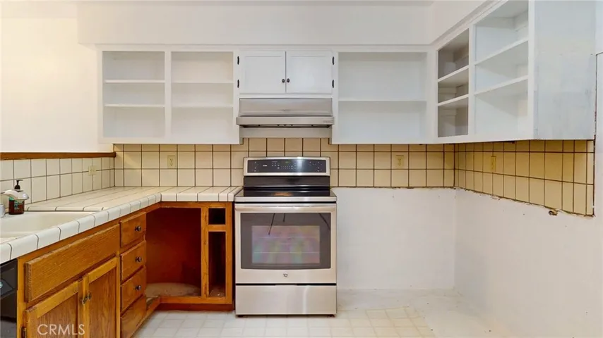 The kitchen is functional but ready for updating.
