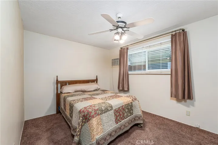 Nice sized bedroom with ceiling fan
