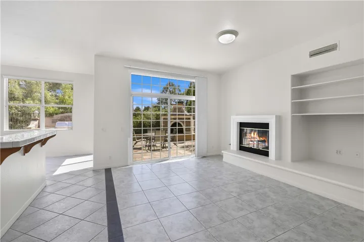 Family Room opens to Kitchen and Dining Room. Sliders to backyard