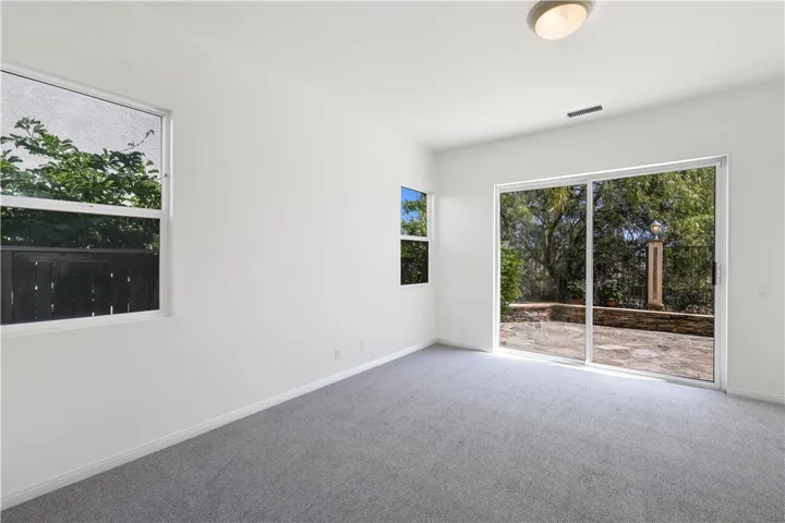 Downstairs Primary Bedroom w/sliders to backyard