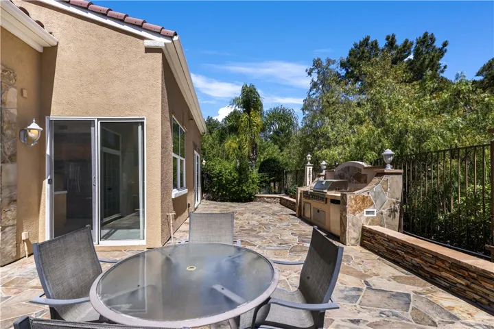 Enjoy going to the backyard thru multiple Sliders from the interior of the house.
