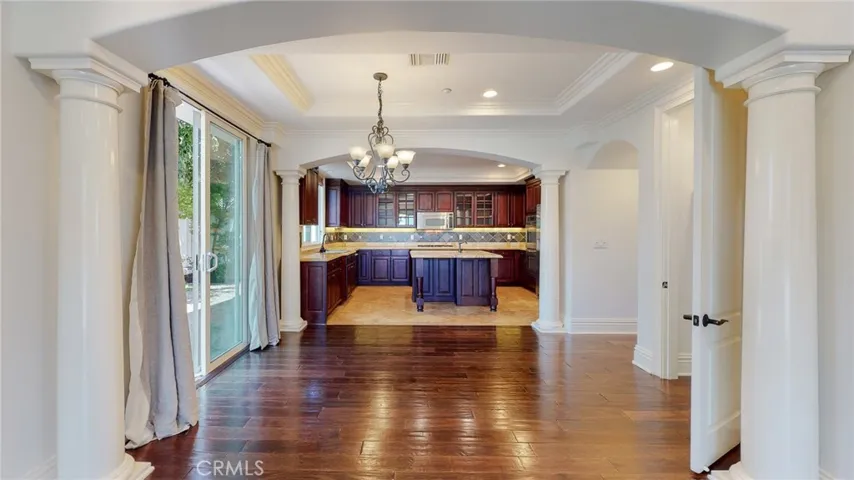 Dinning room open to living room and kitchen, with sliding doors leading to rear yard.