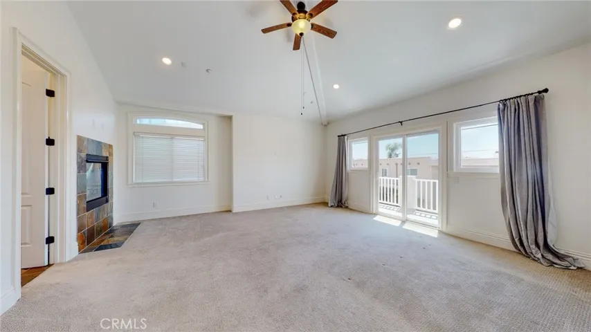 Master Br with sliding door leading to front balcony.