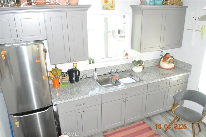 Mini Kitchenette. Sink, Plus Cabinet Space..
