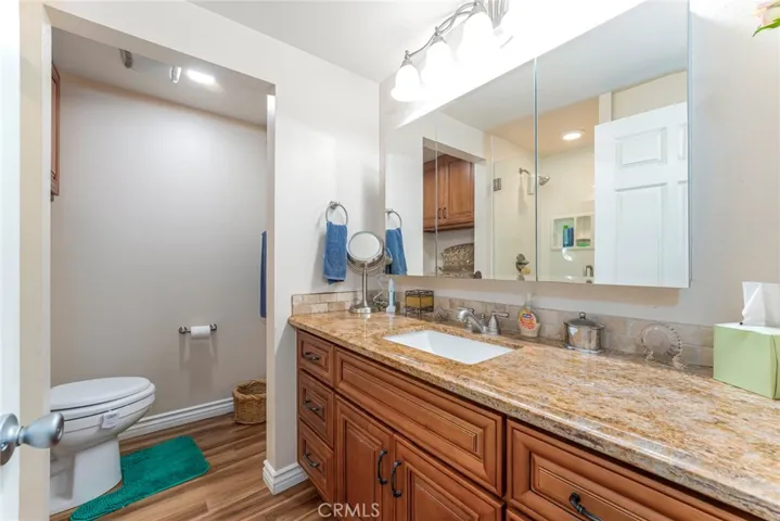 Granite everywhere plenty of storage in bathroom