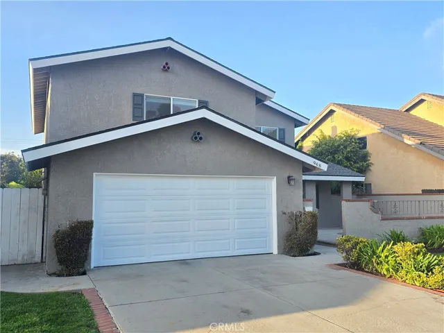 Front of house with 2 car garage