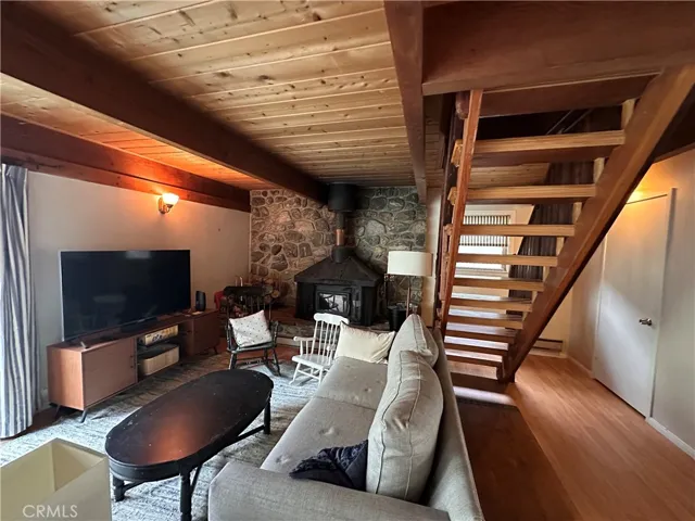 Living room fireplace and stairs to bedrooms