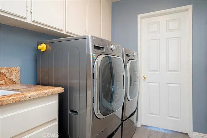 Laundry room and door to downstairs bed/bath