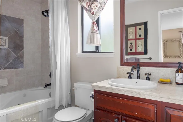 Ensuite bathroom off primary bedroom (over garage).