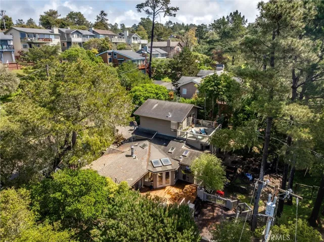 Drone view showing back deck and yard.