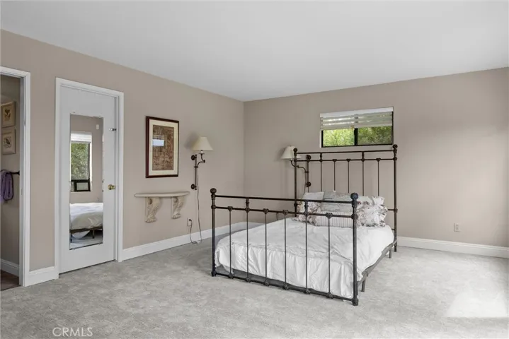 Other side of primary bedroom (door to walk in closet).