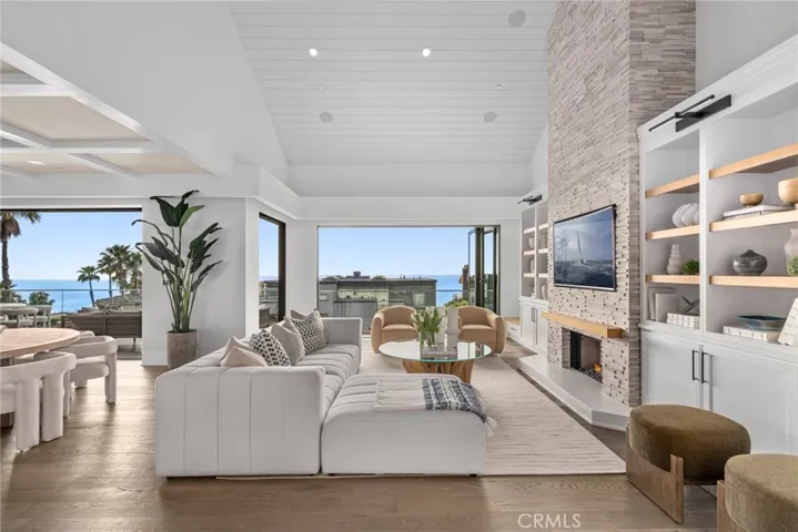 Extensively remodeled and expanded, the modern showplace captures views from indoor and outdoor living spaces.