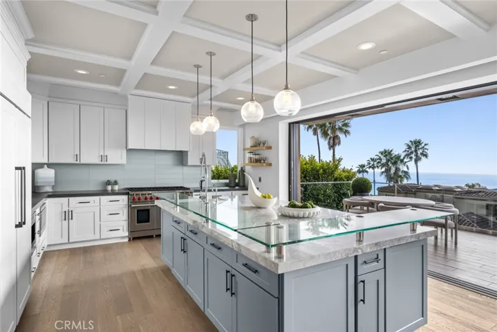 Chefs of all skill levels will appreciate the style and functionality of abundant Shaker cabinetry and stone countertops.