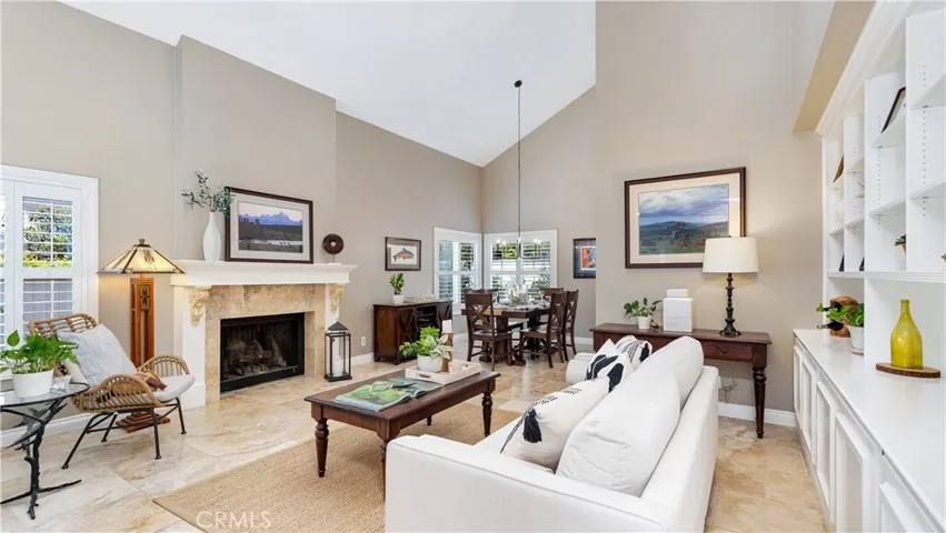 A "Great Room" with a stunning fireplace and custom wall length bookcase