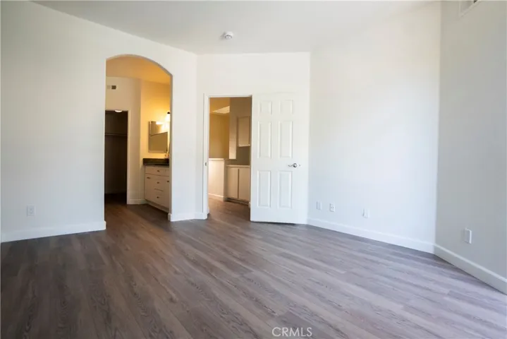 Primary bedroom with ensuite bath and balcomy