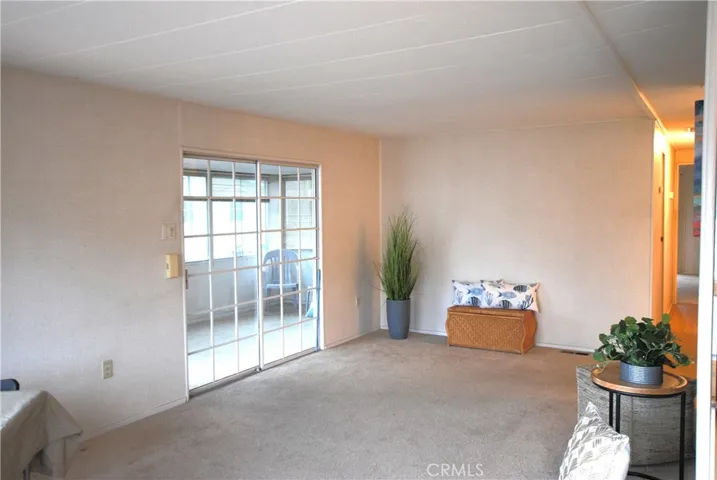 Living room opens to patio room
